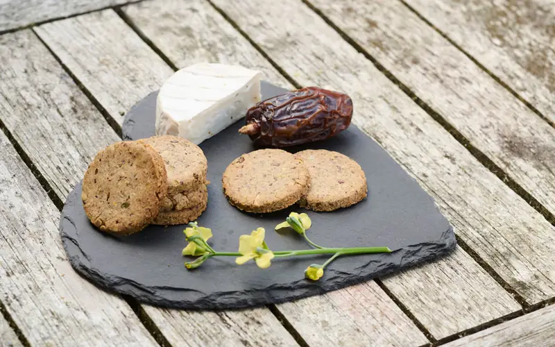 Crackers on a slate with cheese 