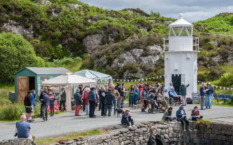 People gathered at the slipway at Glenelg has been repaired allowing the last sea-going, manually operated, turntable ferry in the world to continue to operate.