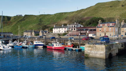 Boats at Scrabster Harbour on a sunny day