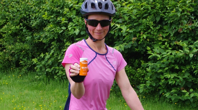 Moira, Owner at Skirr Skin on her bike